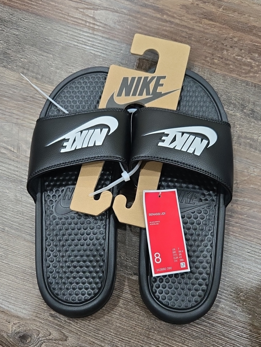 Nike Black Slides with White Swoosh Logo